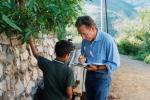 Eugene Hunn interviews a boy identifying plants along a plant trail in San Juan Mixtepec, Oaxaca, Mexico
