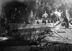 Chumash elder Fernando Librado Kitsepawit (right) directing the building of a tomol