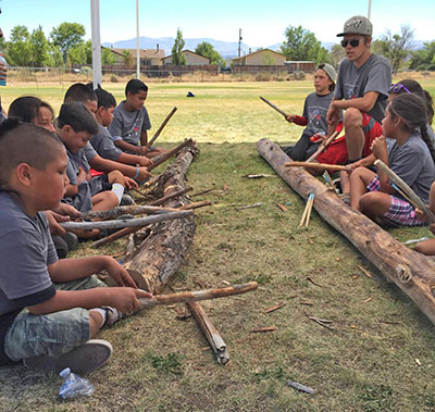 Herman Fillmore teaching Washoe youth the rhythm and song game, Hinoyowgi. Image used with permission of Laura Klivans/KQED.